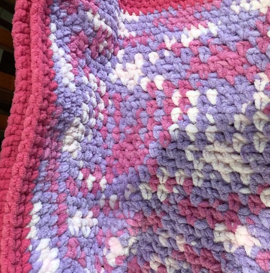 4. Baby blanket bright pink, purple, and white